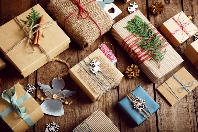 Christmas gifts wrapped in eco-conscious packaging on a wooden table