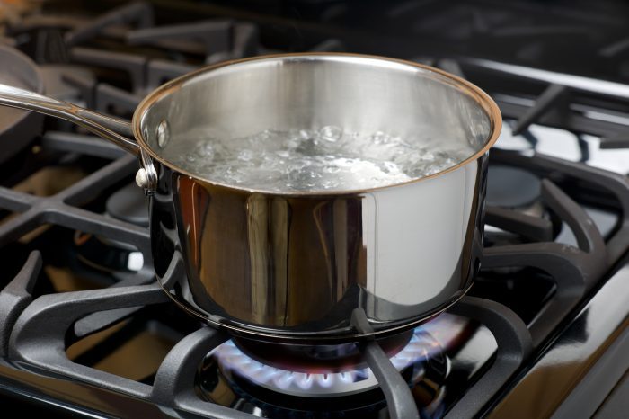 Water Boiling in a pan to be used as an iron