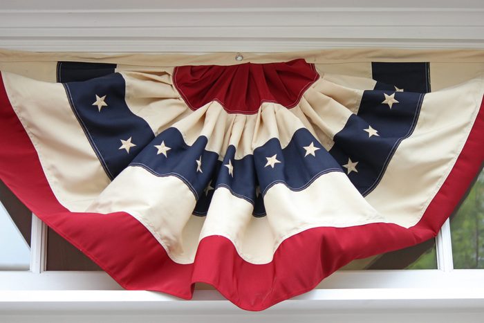 close up of american flag bunting on a window