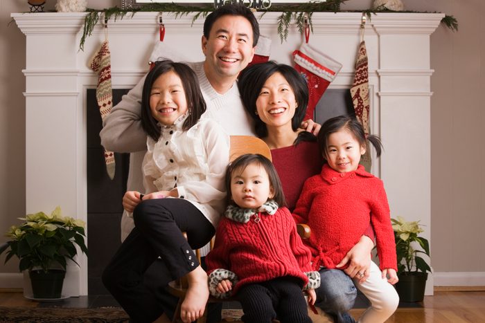 family posing for Christmas photograph
