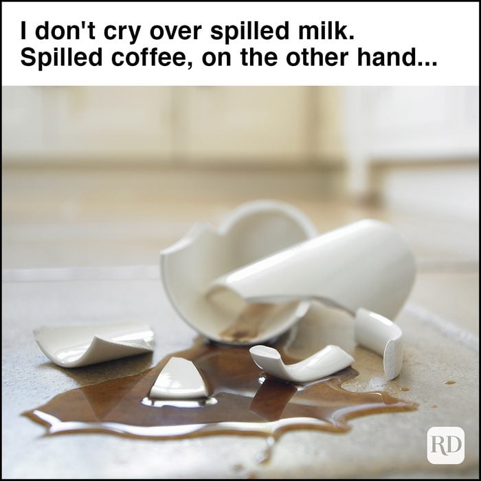 Close up of broken coffee mug and spilled coffee