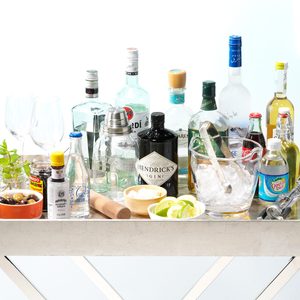 bottles of alcohol set up on a bar cart