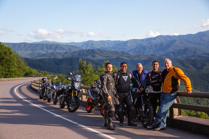 Steve Smith, from left, Sean Patel, Ed DeMik, Pinkesh Patel and Todd Patrick pose for a photo while on a motorcycle ride on the Foothills Parkway in Great Smoky Mountain National Park