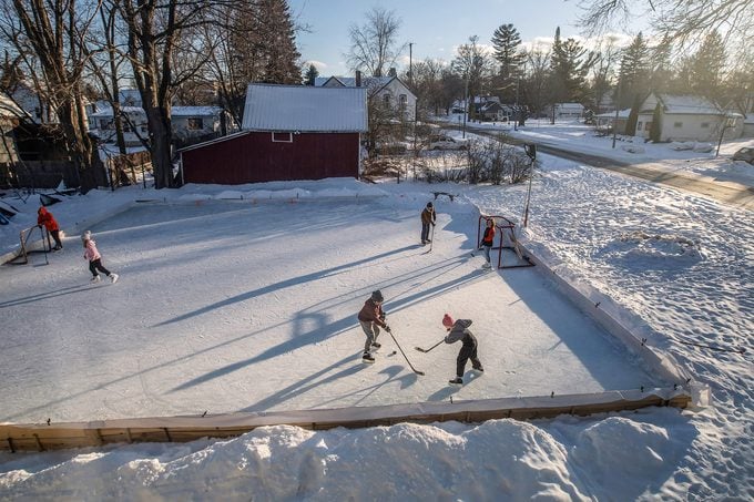 Kids skate on a homemade ice rink made by Scott Chittle at his home in Manton