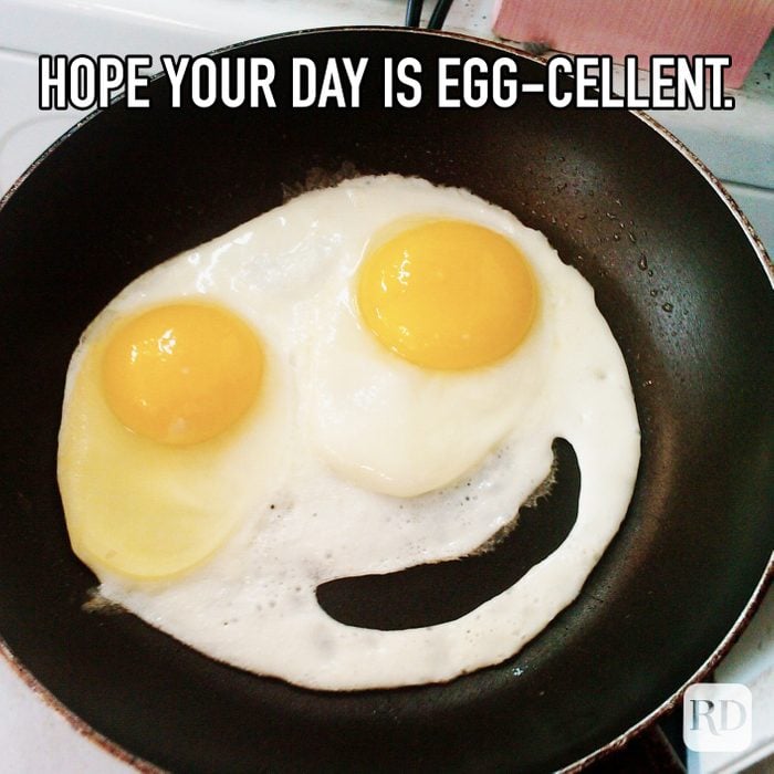 Hope Your Day Is Egg-cellent meme text over image of smiley face eggs
