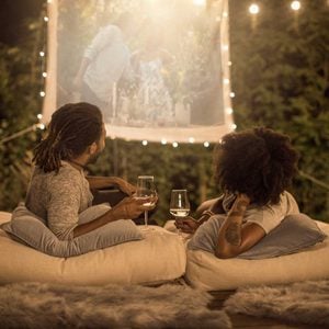 couple watching a movie on an Outdoor Projector