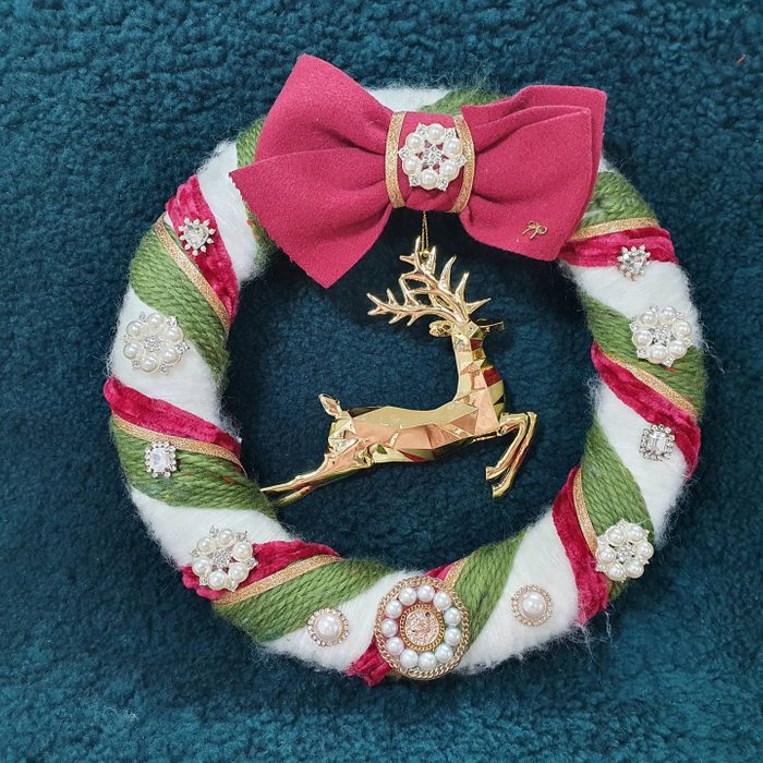 Wrapped yarn and ribbon Christmas wreath