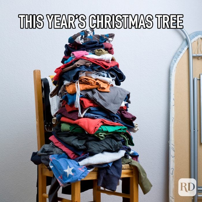 This Years Christmas Tree meme text over chair with pile of laundry