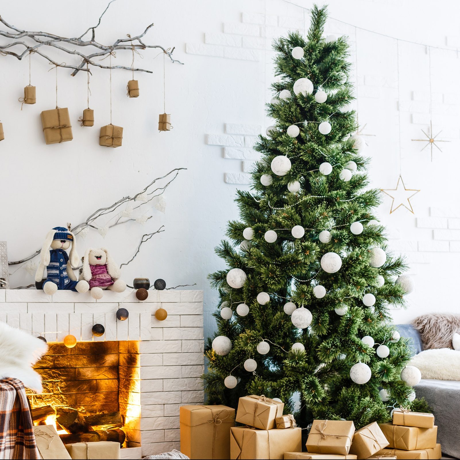 Fireplace and Christmas tree with presents in living room