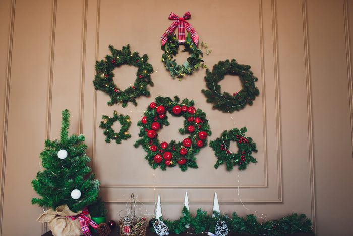 christmas wreaths hanging on wall in house