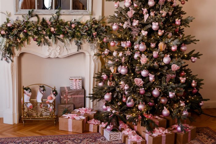 Christmas socks hanging on the mantelpiece. elegant Christmas tree