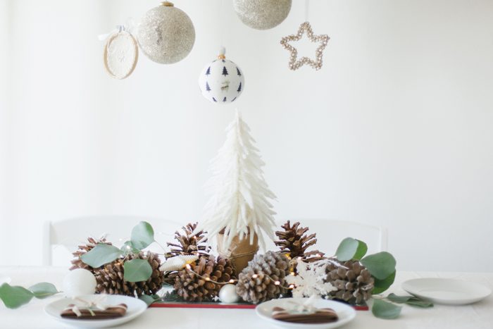 White and brown Christmas table decorations with eucalyptus leaves