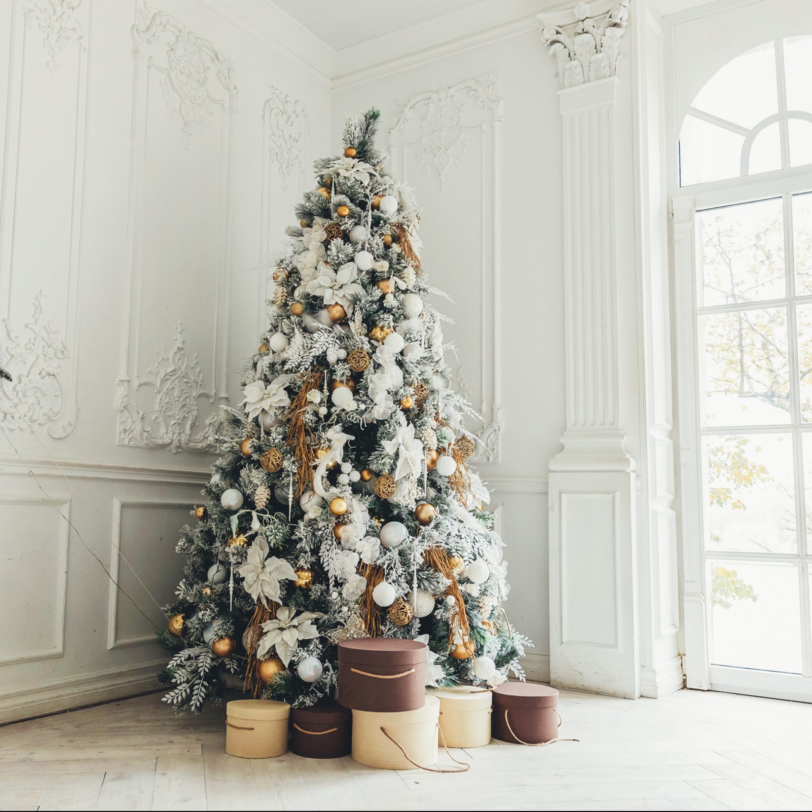 Classic christmas New Year decorated interior room New year tree. Christmas tree with gold decorations