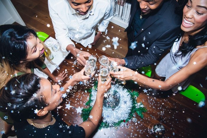 High angle view of friends toasting champagne at party