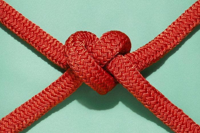 red ropes tied in a knot shaped like a heart