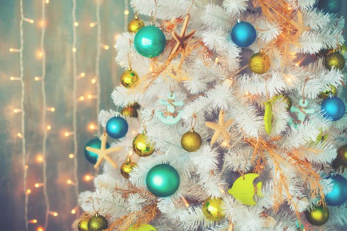 White decorative xmas tree with colourful balls, vintage toned, christmas
