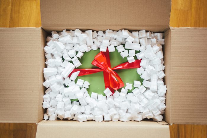 Christmas Gift box in a cardboard box package with packing peanuts