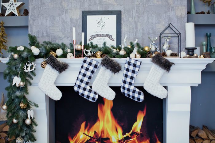 Christmas socks hanging on a fireplace