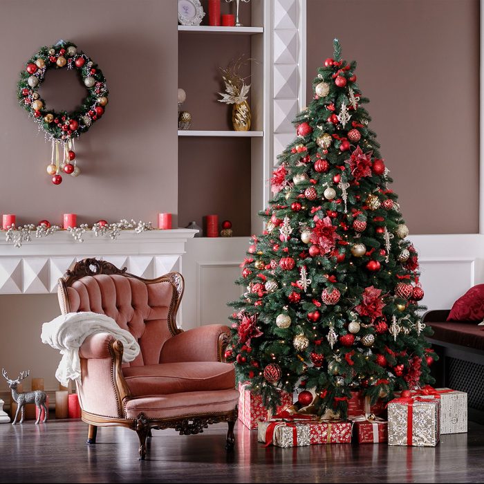 Image of chimney and decorated Christmas tree with gift
