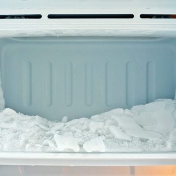 empty freezer with a build up of frost