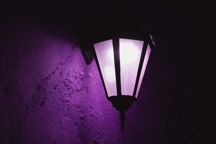 Purple Porch Light close up casting purple light on the wall