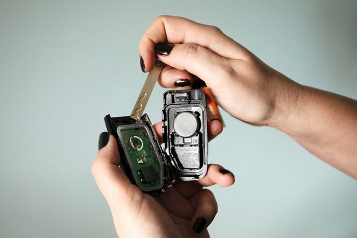 opening a car key fob to change the battery