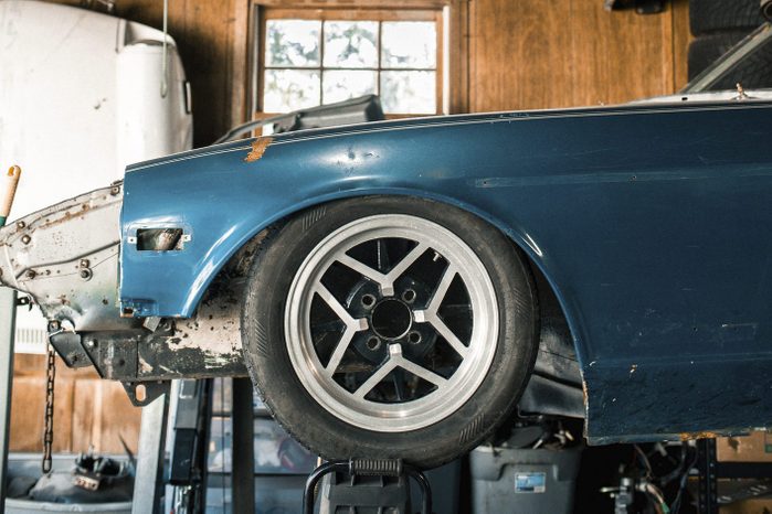 old beater Car in auto repair shop