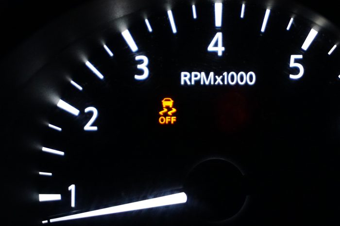 Traction Control Warning Light Illuminated On A Vehicle Dashboard