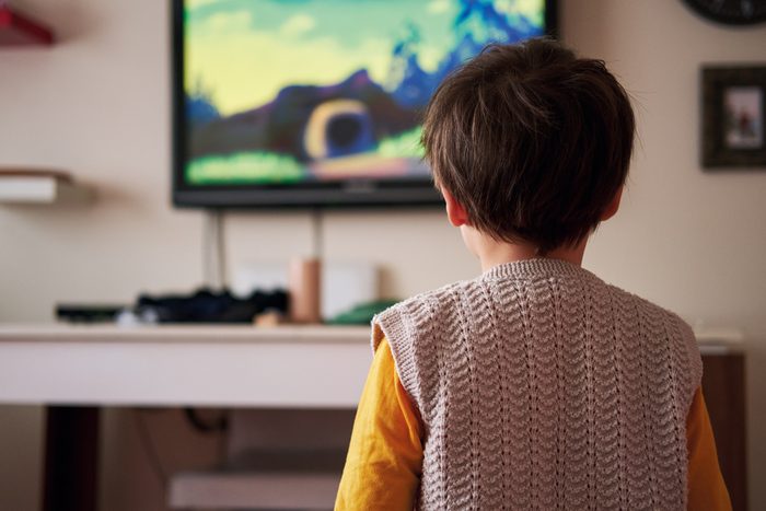 4-5 years old child watching tv at home