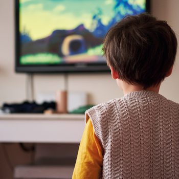 4-5 years old child watching tv at home