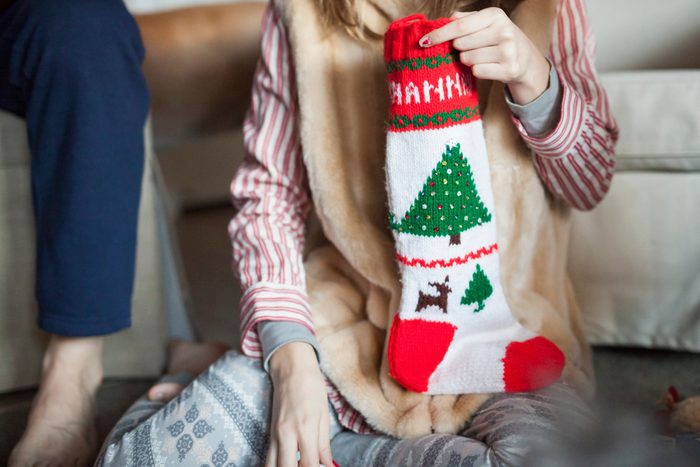 woman holding a christmas stocking