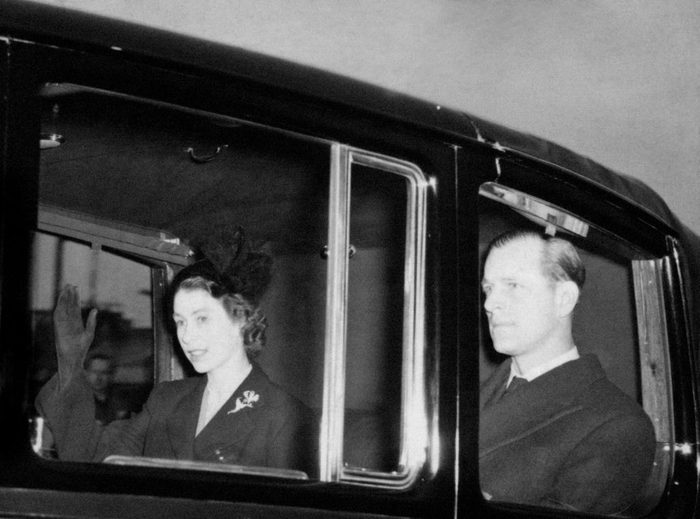 Elizabeth and phillip in a funeral car. Death of King George VI