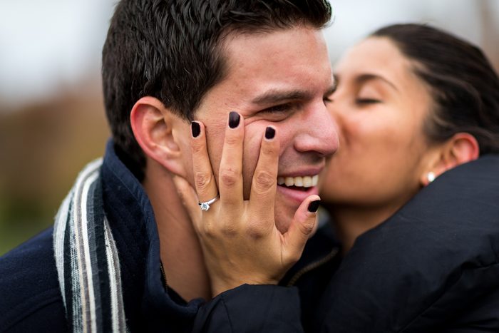 Woman kissing man in cheek, New York City, USA