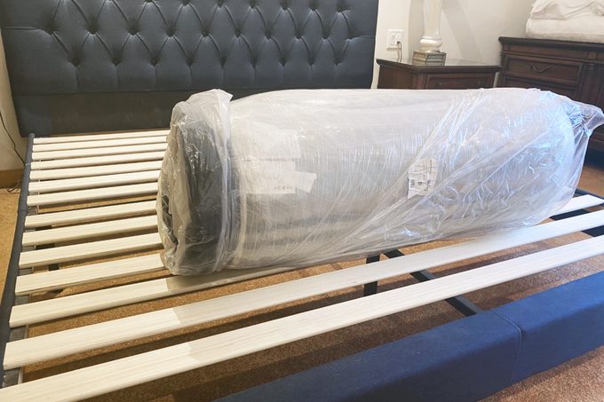 Unwrapped Helix Mattress on bed frame in bedroom