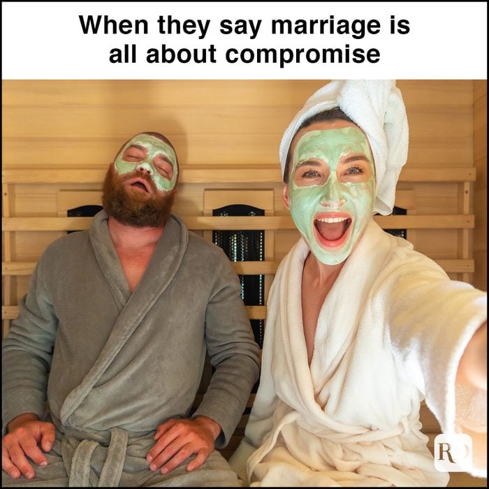 A young funny couple having relax SPA day in sauna, a woman making selfie with beauty mask while her boyfriend is asleep