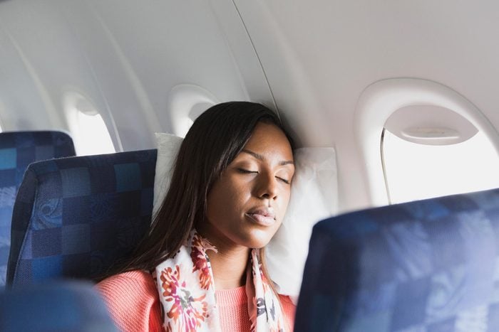 Woman sleeping in airplane