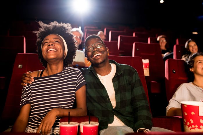 couple on a date watching a movie at the cinema