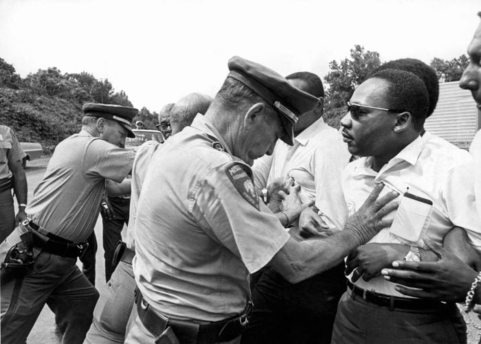 Dr. Martin Luther King being shoved back by Mississippi patrolmen during the 220 mile 'March Against Fear' from Memphis, Tennessee to Jackson, Mississippi, Mississippi, June 8, 1966. 