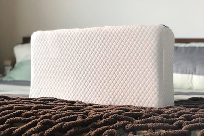 Pillow Cube on top of a bed