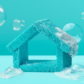 teal house made out of sponges with bubbles all around on teal background