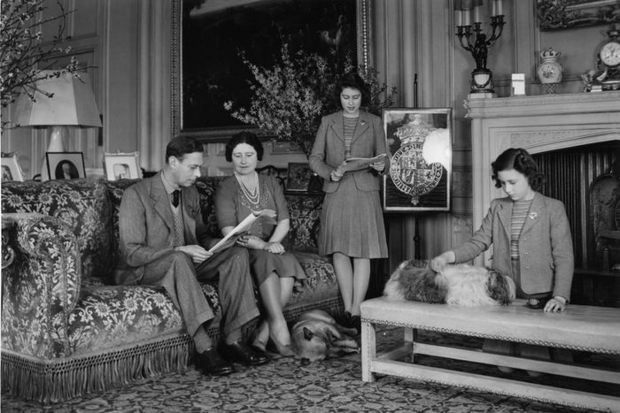 11th April 1942: King George VI (1895 - 1952) and Queen Elizabeth with their daughters, Princesses Elizabeth (centre) and Margaret Rose (1930 - 2002) in a drawing room at Windsor Castle, Berkshire. (Photo by Lisa Sheridan/Studio Lisa/Getty Images)