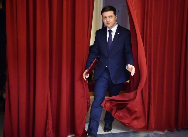 Ukrainian comic actor and the presidential candidate Volodymyr Zelensky enters a hall in Kiev on March 6, 2019, to take part in the shooting of the television series "Servant of the People" where he plays the role of the President of Ukraine.