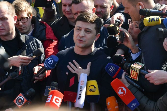 Ukrainian comic actor, showman and presidential candidate Volodymyr Zelensky speaks with the media after casting his ballot outside a polling station during Ukraine's presidential election in Kiev on March 31, 2019.