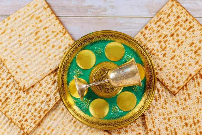 Matzo for Passover on metal seder tray on table