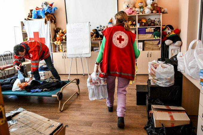Volunteers gather humanitarian aid at a center established by Red Cross after Russian attacks in Zaporizhzhia, Ukraine on February 27, 2022.