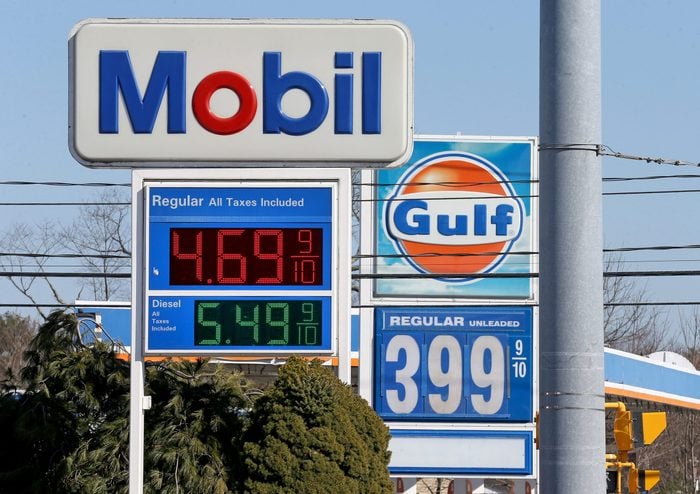 A Mobile station displays $4.69 for gasoline as a Gulf next door has it for $3.99 a gallon on March 14, 2022 in Marshfield, Massachusetts