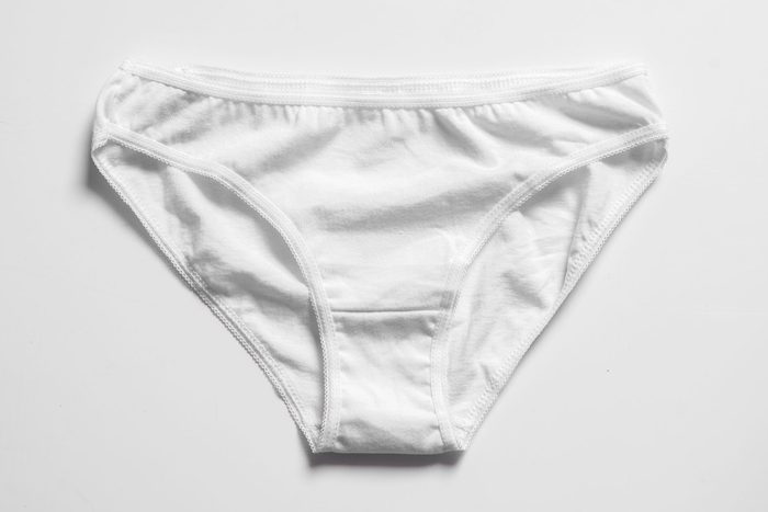 Women's white underwear on white background