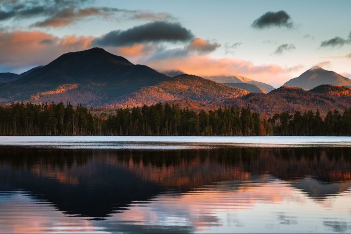 Scenic view of lake by mountains against sky during sunset,Keene Valley,New York,United States,USA