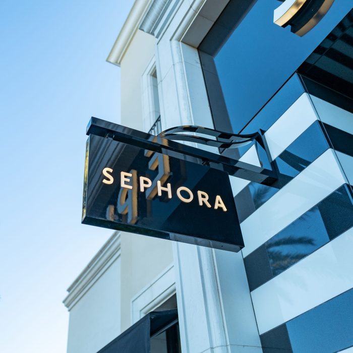 Sephora sign on a building exterior in the shade on a sunny day