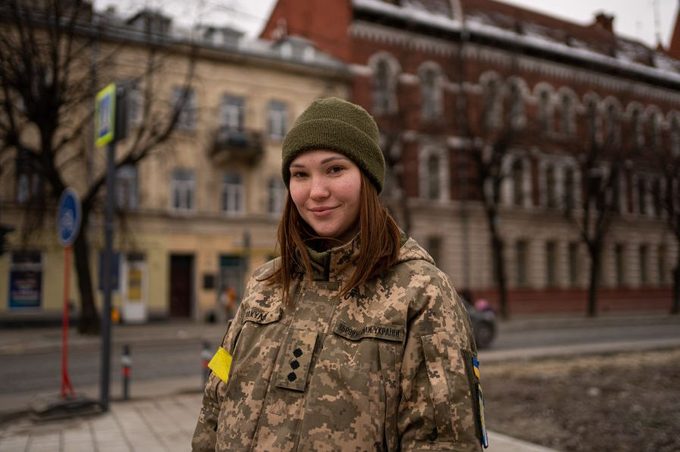 Maryana, a Ukrainian soldier, poses near the Lviv railway station on March 2, 2022, in Lviv, Ukraine.